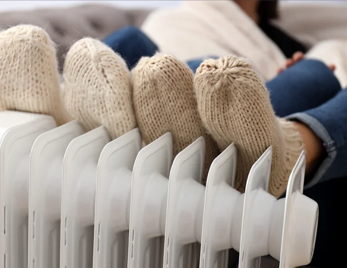 keeping feet warm against radiator